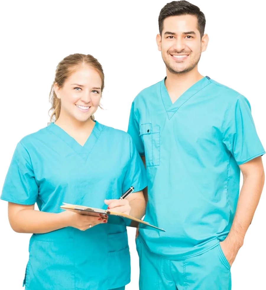 Two chiropractic clinicians in scrubs with a clipboard